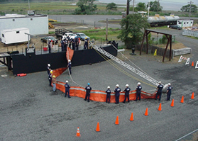 OSRT students deploying flexi-boom on half-hull